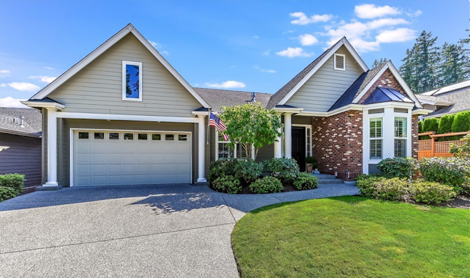 Suburban home with freshly mulched front beds and clean lawn edges