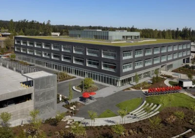 Landscaped grounds at a modern commercial office building with a green roof