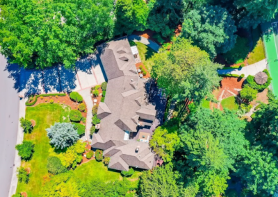 Overhead aerial view of a residential property showing bark beds laid out across the grounds